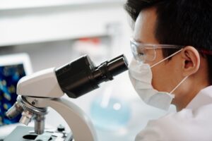 Scientists with microscope
